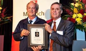 David Pethick receiving VC Excellence in Research Award in 2015