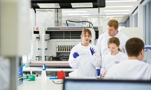 Emeritus Professor Sue Fletcher (left) with researchers in the lab