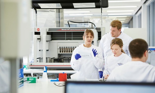 Emeritus Professor Sue Fletcher (left) with researchers in the lab