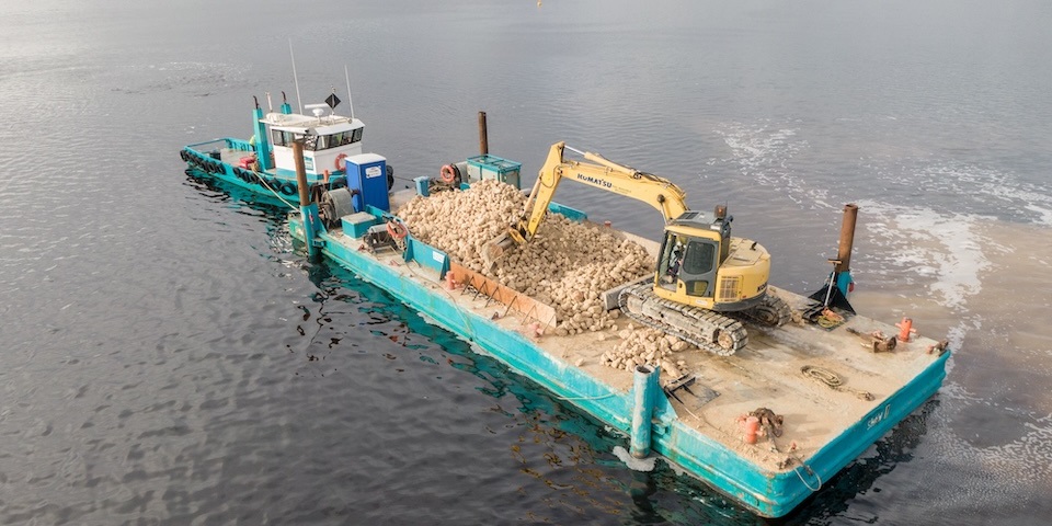 River tug boat with digger